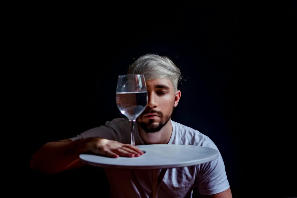 pexels-photo-4430628-4430628 Creative portrait of a man with glass reflection, creating an abstract effect.