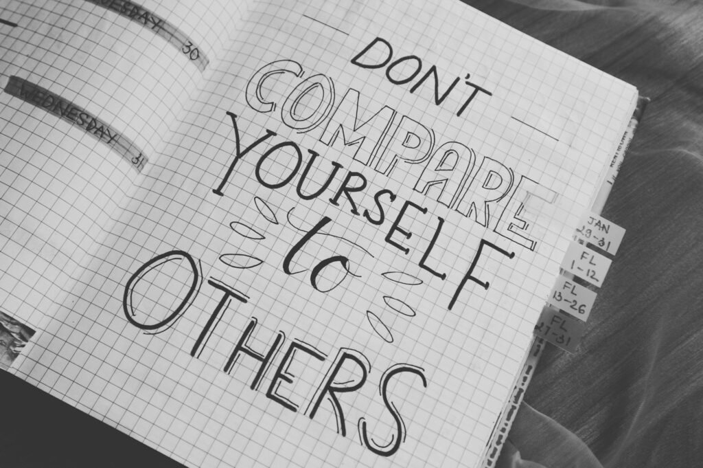 pexels-photo-760728-760728 Black and white photo with motivational handwriting on a grid notebook page.
